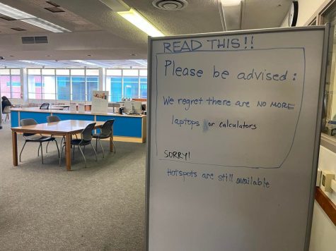 A note written on a whiteboard by a staff member informs students at the El Camino College library that there are no more laptops or calculators left to lend out on Wednesday Sept. 6. (Delfino Camacho | The Union)