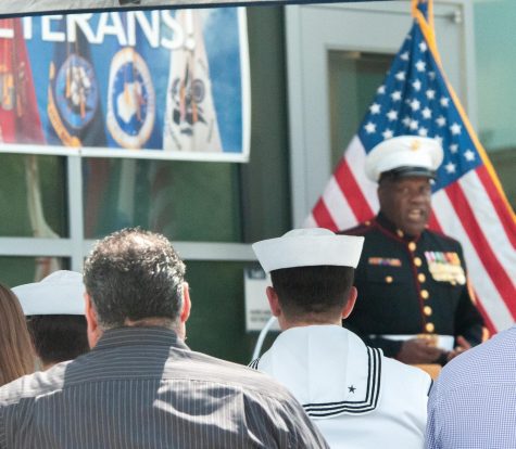United States Marine Corps Sgt. Maj. Charles Cook speaks from the podium as a small crowd sits at attention outside of El Camino&squot;s Student Services building on September 8, 2022, during the Veterans Resource Center&squot;s "Tribute to the Fallen." A commemoration in remembrance of September 11, 2001. (The Union / William Renfroe)