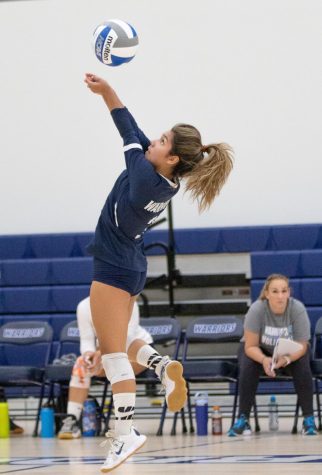 Warriors libero, Crystal Salgado (3), jumps for a dig from a Raiders attack on Wednesday, Aug. 31 at the ECC Gym Complex. Salgado would lead the team with 10 digs during the match. (Ethan Cohen | The Union)