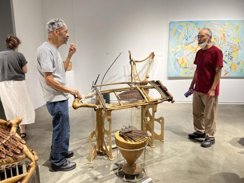 Artist and instrument maker Robert Hilton engages with visitors and demonstrates how many of his instruments work during the SOUNDS exhibit opening on Sept. 10 in the El Camino art gallery.