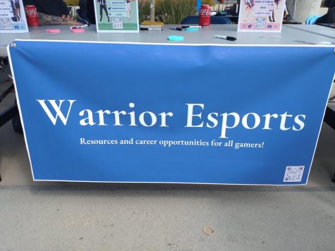 Warrior Esports sets up a booth at the fall Club Rush on Sept. 13. The club meets in the east basement of the library across from Makerspace, Luisa Paredes, president of Warrior Esports, said.