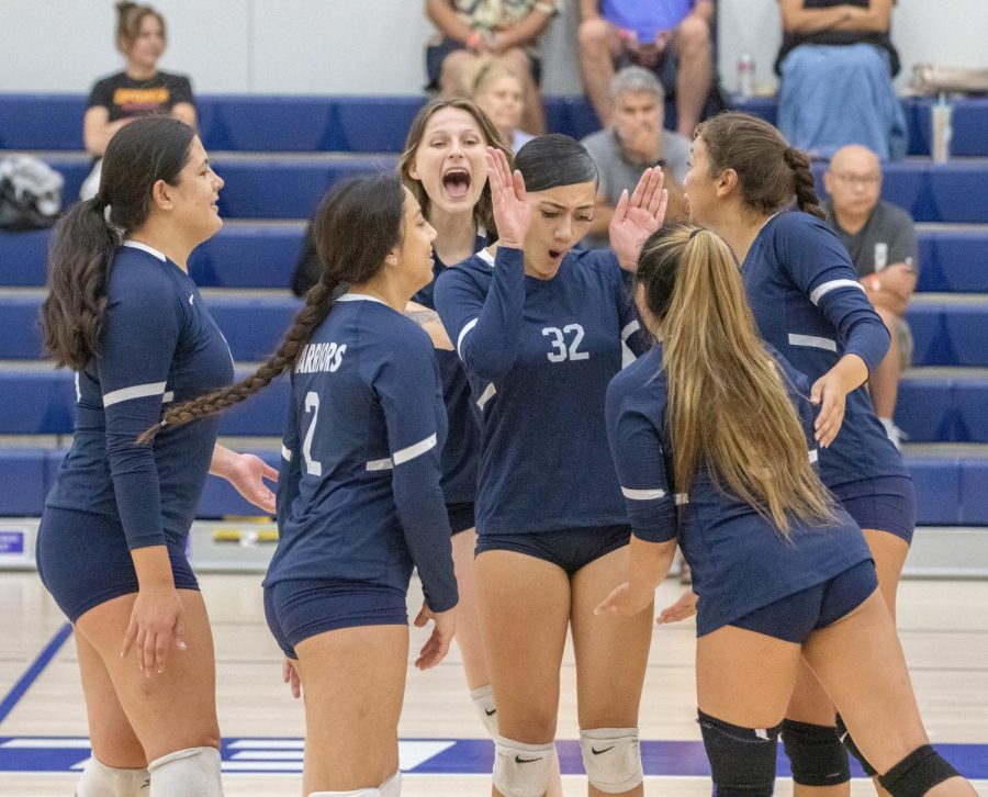 The El Camino Warriors celebrate after winning a point against the Pasadena City College Lancers at the ECC Gym Complex on Friday, Sept. 16. The Warriors won their first conference match after going 0-7 at the beginning of their season. (Ethan Cohen | The Union)