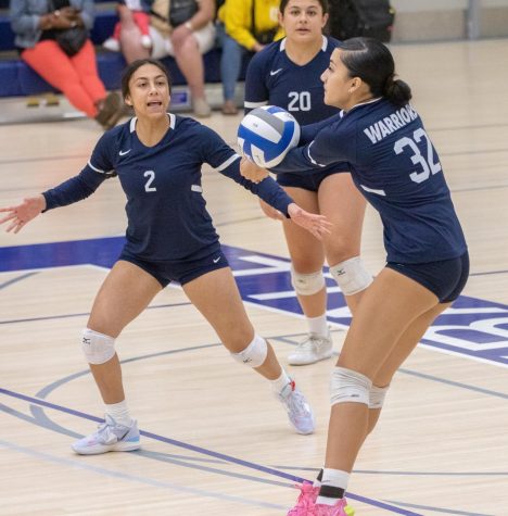Warriors player Leafa Juarez (32) digs the ball from a Lancers' attack at the ECC Gym Complex on Friday, Sept. 16. Juarez shined during the match as she recorded 7 digs and 28 kills helping push the Warriors over the edge to victory. (Ethan Cohen | The Union)