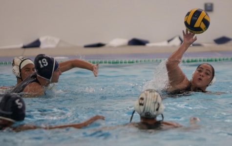 Brooke Baudendistel (left) tries to reach the ball in the fourth period of the game.  The Warriors won 13-6 and will play Mt. San Antonio at home on October 5.  (Raphael Richardson | The Union)