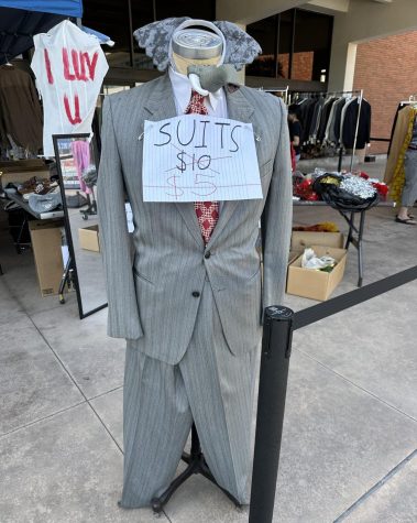 Suit with elephant accessories and a sign showing discounted prices on the second day of the Halloween Costume Sale outside the Marsee Auditorium, Thursday, Oct. 20, 2022.
