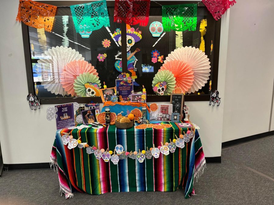 An ofrenda or offering display currently on display at the El Camino College Library, taken on Oct. 7. Students and staff members were encouraged to provide personal photos and art pieces to include in the display. (Delfino Camacho | The Union)
