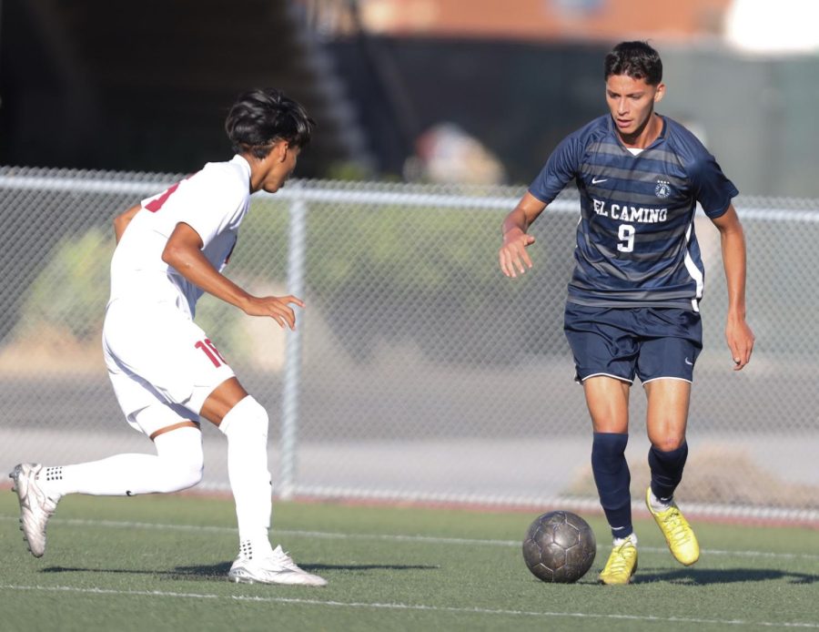 Sophomore+forward+Mario+Carlos+%289%29+attempts+to+get+past+a+Pasadena+City+defender+during+an+Oct.+18%2C+South+Coast+Conference+matchup+held+at+El+Camino+College.+Carlos+scored+a+goal+during+the+second+period+of+play.+We+have+high+expectations.+For+us%2C+we+need+to+win+every+game%2C+Carlos+said.+El+Camino+will+play+another+home+conference+game+on+Friday%2C+Oct.+21%2C+against+East+Los+Angeles+at+4+p.m.++%28Greg+Fontanilla+%7C+The+Union%29