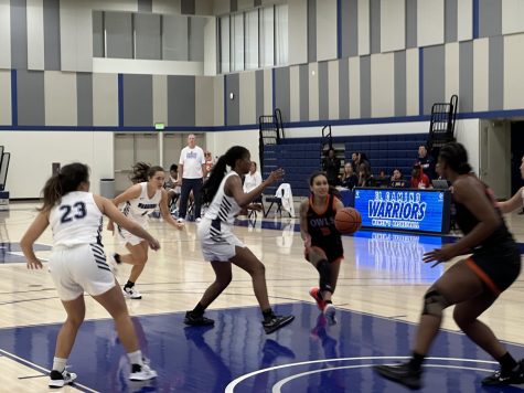 Citrus College Owls sophomore guard, Reanne Reola, dribbles past El Camino Warriors forward, Imani Taitt-Gibbs, towards the basket on Friday, Nov. 11 in the ECC Gym Complex.