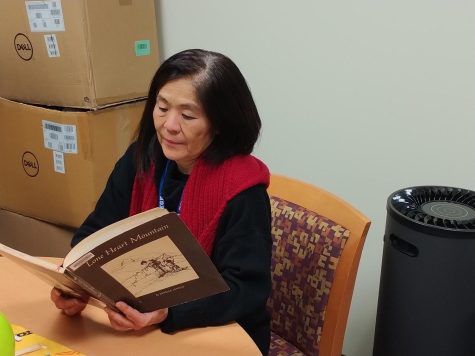 While reading "Lonely Heart Mountain" by Estelle Ishigo, Deputy Director of the Learning Resources Center Sheryl Kunisaki said Kenji Kunisaki, her stepfather, was featured in the book.  It is displayed with the "Images: American concentration camps" exhibition at the library.  The exhibition will end on December 9.  (Anthony Lipari | The Union)