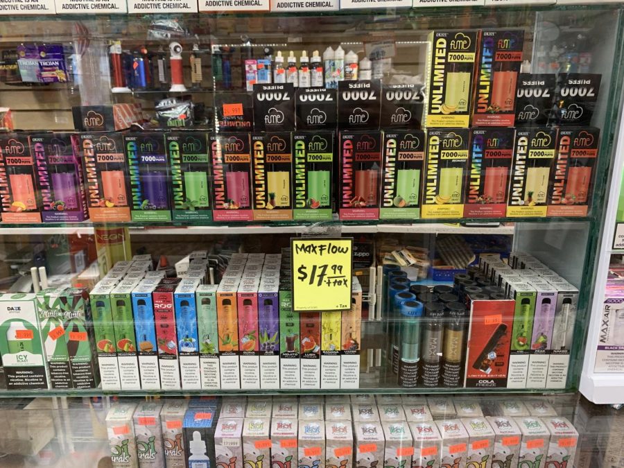 Windows filled with various types of flavored vapes inside JS Smoke Shop corner of Artesia and Crenshaw Blvd. Flavored tobacco products are a major part of smoke shop revenue streams. (Igor Colonno | The Union)