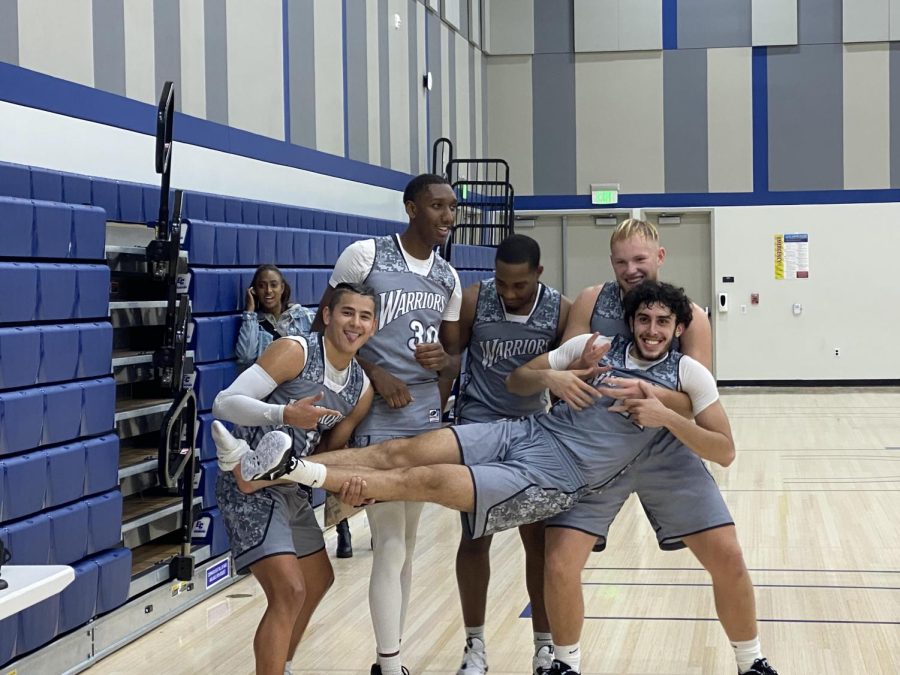 From left to right: Alexis Maria, Casey Cook, Dwayne Moore, Mattias Sjolin and Mo Cruz share a celebratory victory pose after winning against Barstow College (110-69). The Warriors, now 6-2 overall, will face off against College of the Desert on Dec. 1. (Khoury Williams | The Union)