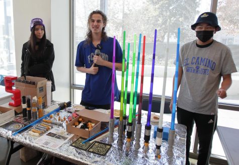 El Camino student Joseph Dean, middle, shows off lightsabers made by 3D-printing, during the Robotics Exhibition in the ITEC Building, on Wednesday, Dec. 7. (Raphael Richardson | The Union)