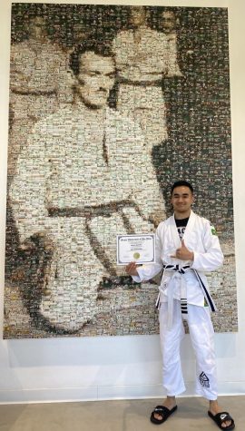 Greg Fontanilla with his promotion belt and certificate on Jan. 17 at Gracie University in Torrance.