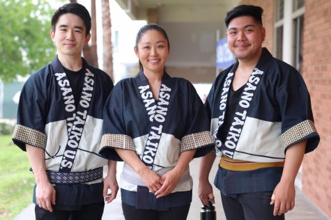 From left: Masa Miyano, Julia Asano and Fred Nisaya of Asano Taiko U.S.’s UnitOne performing ensemble, pose for a photo outside of the Social Justice Center during the 23rd Annual Cherry Blossom Festival on March 15. (Photo by Raphael Richardson | The Union)