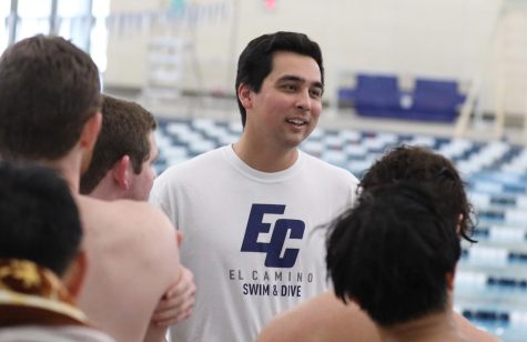 El Camino head coach Noah Rubke talks to his swimmers during a South Coast Conference dual meet against Cerritos at the ECC Aquatics Center on Friday, March 24. The women's team defeated Cerritos 137-114, while the men's team fell short 144-125. (Greg Fontanilla | The Union)
