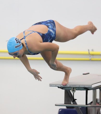 Melissa Brill takes off to get her race started at the ECC Aquatics Center on Friday, March 24. Brill took a second place finish in the women's 1000-yard freestyle, first place in the 500-yard free, and in the 400-yard freestyle relay that included the quartet of Diana Nguyen, Mia Park, and Angelina Norris. (Greg Fontanilla | The Union)