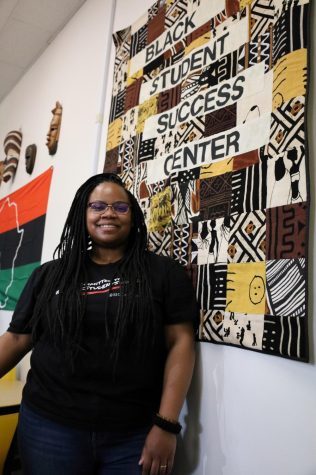 Student Success Coordinator Keiana Daniel poses with a handmade quilt for the Center, during the "soft opening" of the Black Student Success Center" in the Communications Building, on Feb. 22, 2023. (Raphael Richardson | The Union)