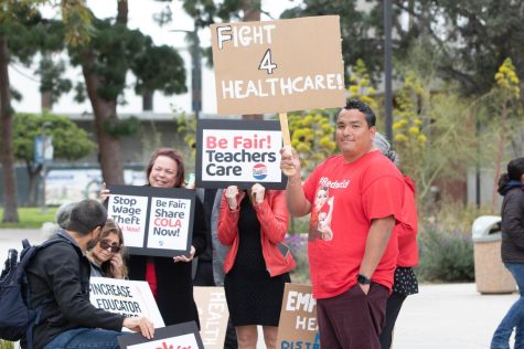 Members of the Federation of Teachers gather outside the Administration at El Camino College to protest the ongoing contract negotiations before the Board of Trustees meeting on Monday, March 20. (Ethan Cohen | The Union)