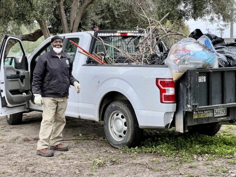 Cedrick Buckner, a ground maintenance worker at Alondra park who resides in Compton, cleaned up tree branches on the park ground Tuesday, March 14. (Nindiya Maheswari | The Union)