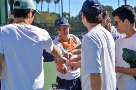 The men's tennis team for El Camino College all huddle in as their coach, Sergiu Boerica, gives a motivating speech to hype them up before their game. El Camino defeated Imperial Valley at home. Ash Hallas | The Union