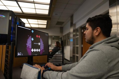 Electronics and computer hardware technology major Joshua Diaz choose to relax in between classes playing rhythm-based games like "Osu!" at the Warrior Esports Center on Feb. 27.