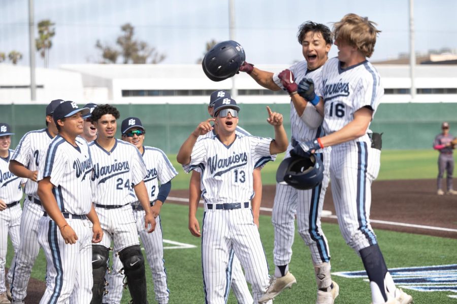 Warriors centerfielder Elijah Tolsma celebrates with the El Camino dugout after a two-run homerun. El Camino won in the 10th inning against Mt. SAC 3-2. (Ethan Cohen | The Union)