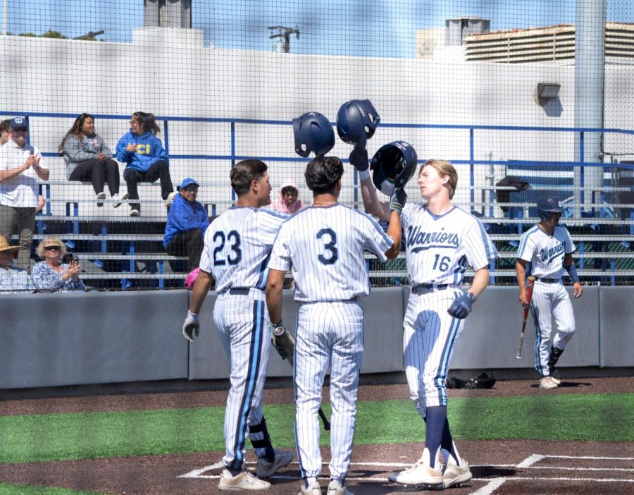 Warriors centerfielder Elijah Tolsma hit dings his helmet together with Daniel Murillo in celebration of hitting a home run against Glendale. The game was held at El Camino College on Thursday, April 6 and won against Glendale with a score of 9-2. (Ash Hallas | The Union)