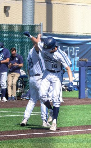 Elijah Tolsma, (right) celebrates on his way home after hitting a two-run home run that led to El Camino College taking the lead. El Camino College won its game against Glendale 9-2 on Thursday, April 6. (Ash Hallas | The Union)