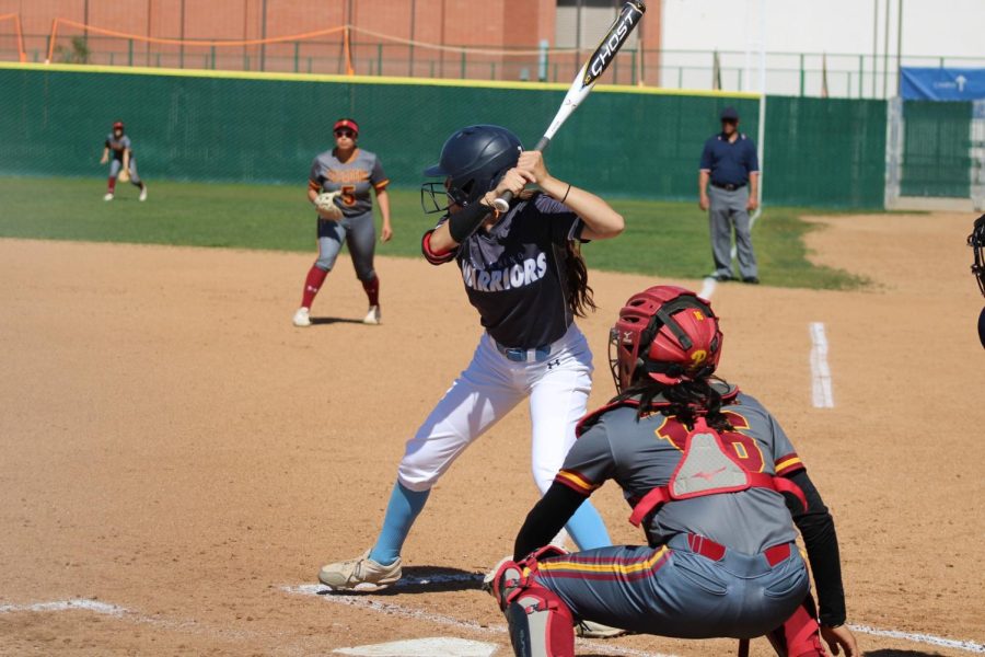 El+Camino+College+Warriors+outfielder+Alyssa+Lujan+prepares+to+swing+at+a+pitch+from+Pasadena+City+College+Lancers+pitcher+Austyn+Helmuth+%28out+of+view%29+while+Lancers+catcher+Alyssa+Guzman+waits+for+the+ball%2C+on+Thursday%2C+April+6%2C+at+the+ECC+Softball+Field+in+Torrance.+Lujan+was+named+to+the+2022+National+Fastpitch+Coaches+Association+All-America+Team+and+the+2022+All-South+Coast+Conference+Second+Team.+%28Elsa+Rosales+%7C+The+Union%29