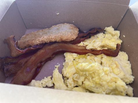 Warrior Starter breakfast combo meal has scrambled eggs, a choice of bacon or sausage and potatoes. The meal costs $6.29.