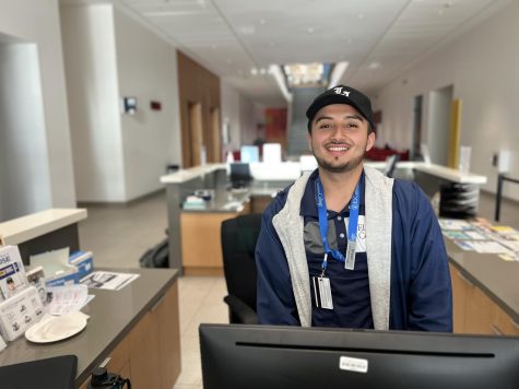 Bryan Ventura, 21, a computer science major, works as an outreach ambassador inside El Camino College Student Services building. Ventura said that he applied for the job because he was passionate about helping people. (Nindiya Maheswari | The Union)