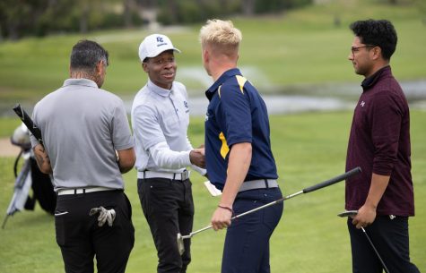 Stevie Valenzuela (left), Tyshawn Christy, Will Oates and Ezekiel Martinez all shake hands and congratulate each other after completing the 5-hour-long 18-hole south course at the Los Serranos Country Club in Chino Hills on April 12. Christy said he plans to continue playing golf for the future. (Khoury Williams | The Union)