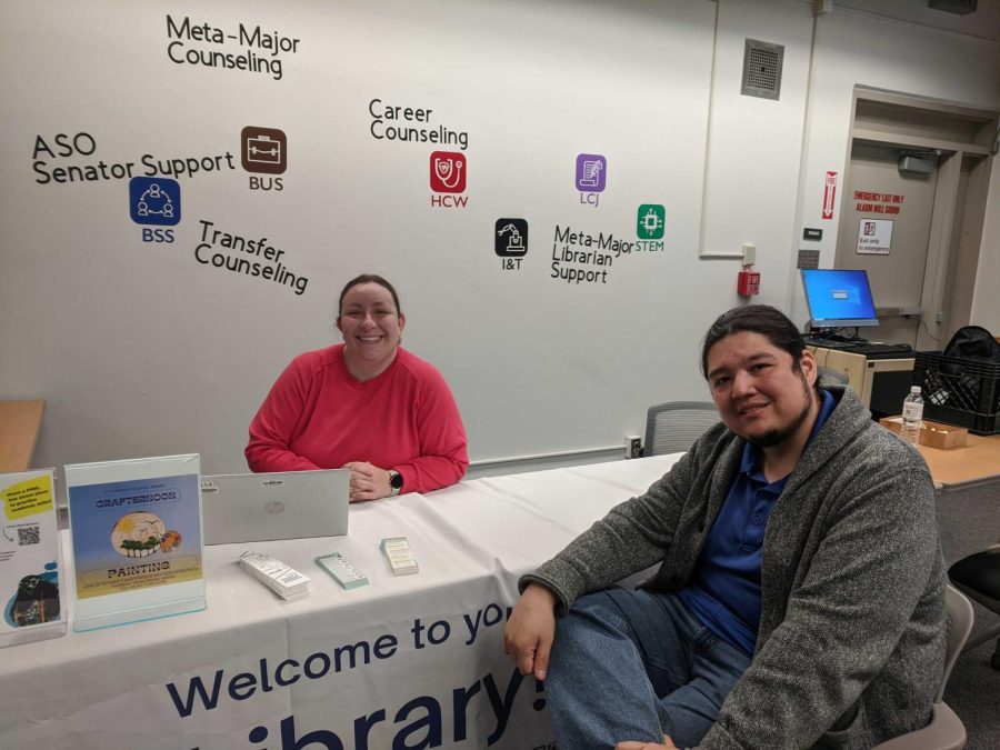 Camila Jenkin (left) and Steve Dao manning the library table within the Meta-Majors Center. The center is going through a soft-opening phase before fully opening in the fall of this year. (Ari Martinez | The Union)