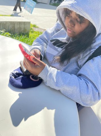 Radiology Technician major Rahlynn Owens scrolls through her Instagram feed before class on April 5. Owens occasionally uses social media to stay connected with friends and watch educational videos.  (Jesse Chan | The Union)
