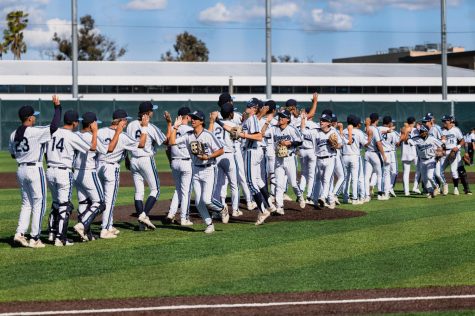 The Warriors high-five and celebrate after their 2-0 win against the Mt. San Jacinto Eagles. The Warriors and Eagles went scoreless through seven and a half innings before two runs were brought in off a single from Elijah Tolsma breaking the stalemate. (Ethan Cohen | The Union)