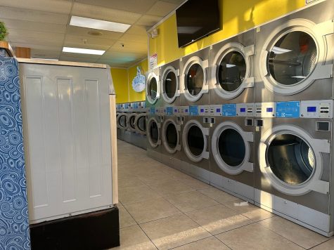 Two rows of drying machines on a wall inside Magic Laundry located in a small plaza between Rosecrans Avenue and West 145th Street in Lawndale on Sunday, March 26. (Eddy Cermeno | The Union)