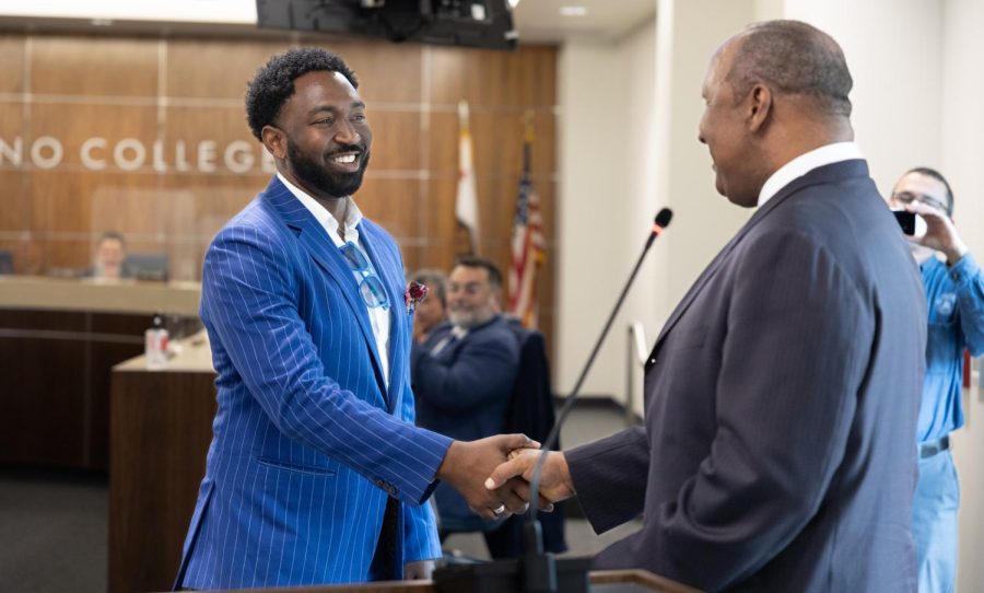 New trustee member Brett Roberts shakes the hand of Inglewood Mayor James Butts after getting sworn into his position during the Board of Trustees Meeting on May 15. (Khoury Williams | The Union)