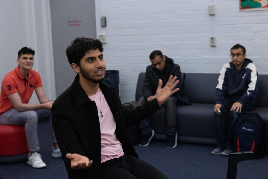 Business administration major Uzair Pasta plays a game of “Mafia” at the Social Justice Center on April 5. Pasta’s work with the forensics team has garnered him more than 20 trophies, over 100 medals, and about a dozen certificates. (Khoury Williams | The Union)
