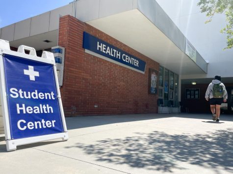 A student walks toward the Student Health Center Building at El Camino College. The college district recently proposed a contract that includes a cut to clinical psychologists pay if accepted by the faculty union. (Ethan Cohen | The Union)