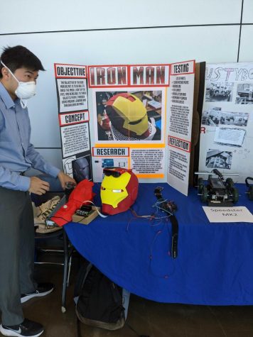El Camino Robotics Club President Jason Irie presents his Iron Man helmet at the robotics exhibition on Wednesday, May 31. (Matheus Trefilio | The Union)
