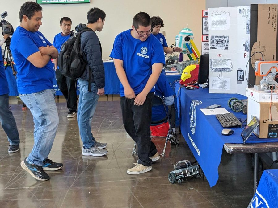 El Camino Robotics Club member Sebastian Araque Vera dances with his salsa robot at the robotics exhibition on Wednesday, May 31. The exhibition hosted many robots including Marvel and Star Wars-themed droids. (Matheus Trefilio | The Union)