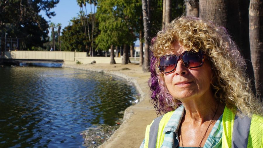 Biologist DeAna Vitela works cleaning Alondra Park Lake. She is optimistic about the restoration of Dominguez Channel. “There is still hope to save the creek,” she says. (Alexis Ramon Ponce | Warrior Life)