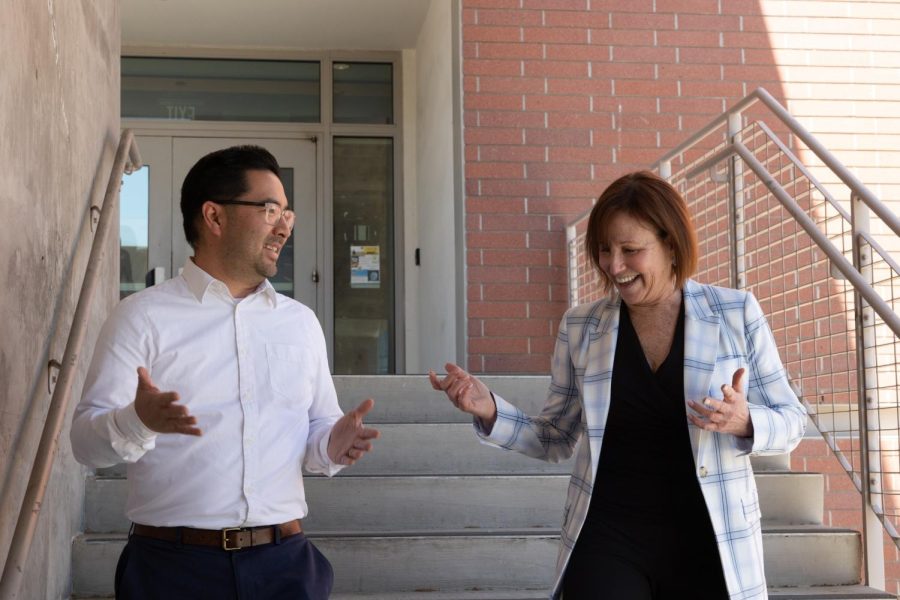 El Camino College Associate Dean of Humanities Scott Kushigemachi and Dean of Humanities Debra Breckheimer discuss plans while walking down the stairs outside of the Humanities Building on March 27. Breckheimer has been with El Camino for 30 years. (Khoury Williams | Warrior Life)