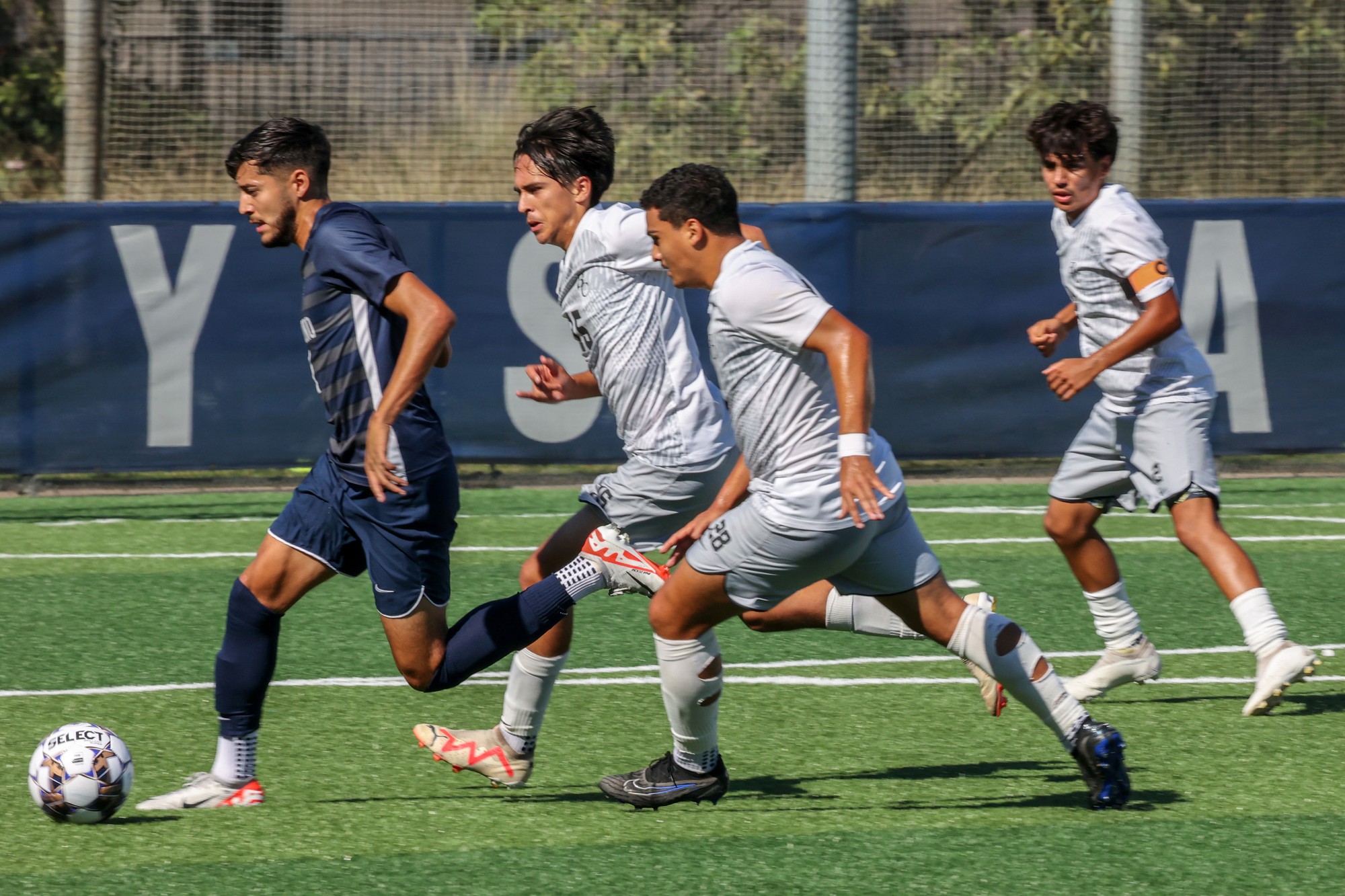 An EC soccer player is chased down by a group of Bakersfield players during a mens soccer game against Bakersfield College at El Camino College on Tuesday, Sept. 26, 2023. (Bryan Sanchez | The Union)