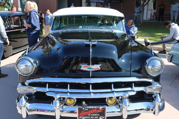 A classic 1950s Chevrolet displayed for the F.I.R.S.T event in front of the Social Justice Center