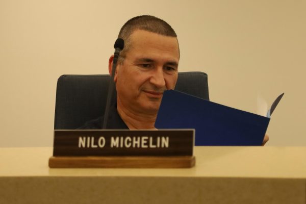 EC Board of Trustee member Nilo Michelin reviews paperwork in the Board Room of the Administration Building at El Camino College on Wednesday, Sept. 6, 2023. (Nathaniel Thompson | The Union)