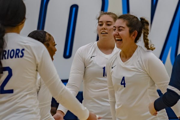 El Camino players celebrate a side out as Bridget Dorr led them to success as the main setter of the match. (Ethan Balderas | The Union)