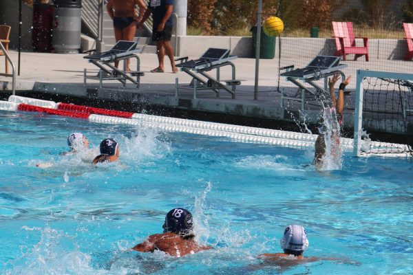 A goalie tries to block a shot during a El camino versus Fullerton water polo game at Mount San Antonio College on Friday, Sept. 15, 2023. (Joseph Ramierz | The Union)