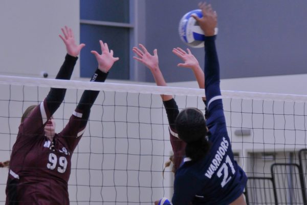 Outside Hitter and Opposite Payton Garrison spikes a ball towards two Mt. San Antonio blockers during the Sept. 20 women's volleyball game at the South Gym. (Ira Mendoza | The Union)