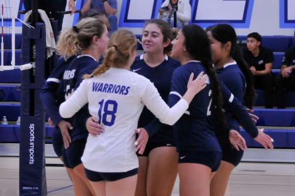 The El Camino team praise each other after a play in a women's volleyball game at the South Gym on Wednesday, Sept. 20. (Ira Mendoza | The Union)
